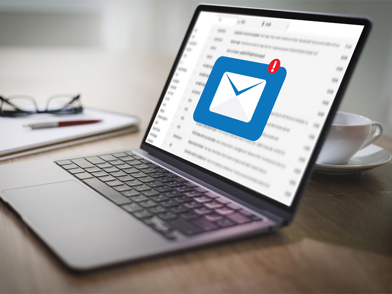 Laptop screen displaying an email notification, representing how to file a complaint